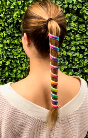 Model wearing Ponytail Wrap - 12" Unicorn Rainbow Leather Vibrant Hair Accessory