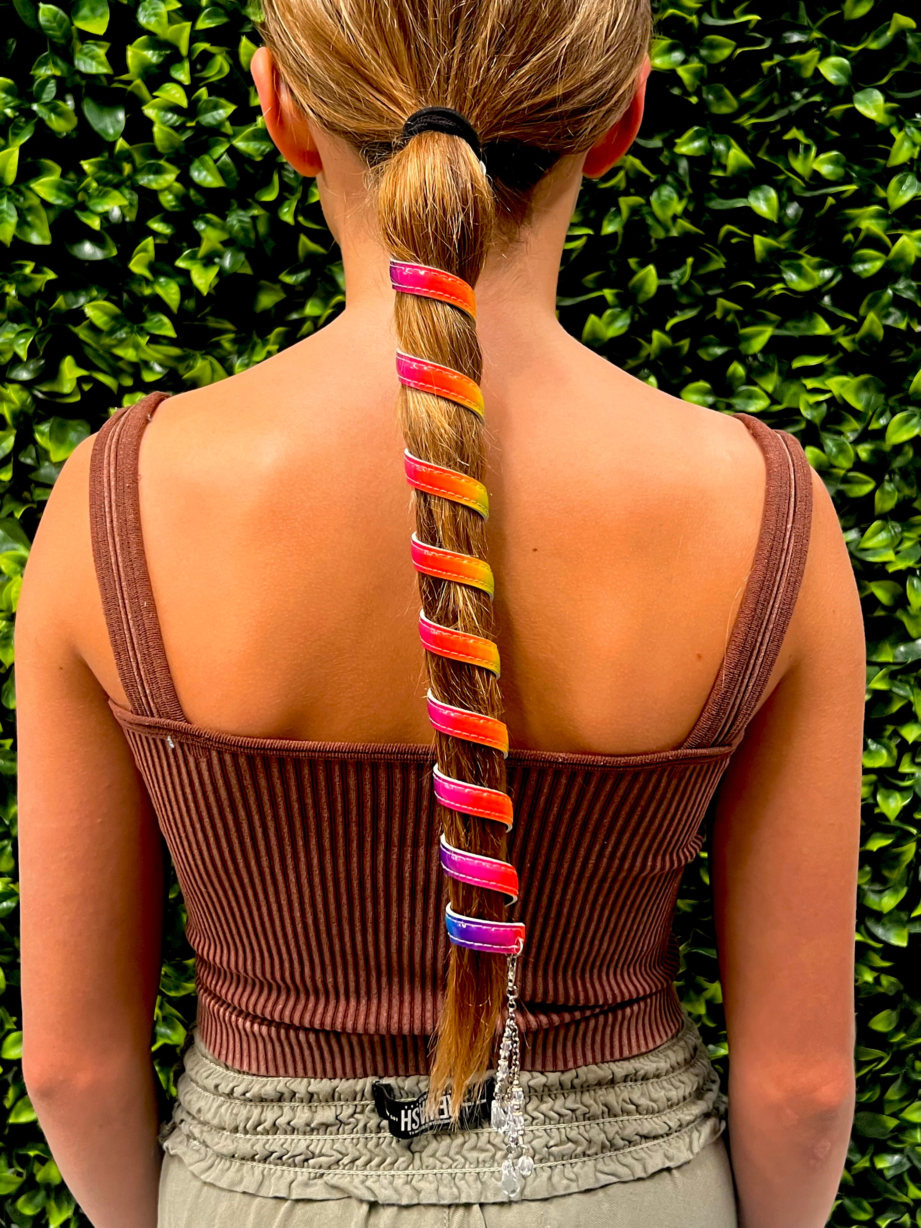 Model wearing Ponytail Wrap - 12" Unicorn Rainbow Leather Vibrant Hair Accessory